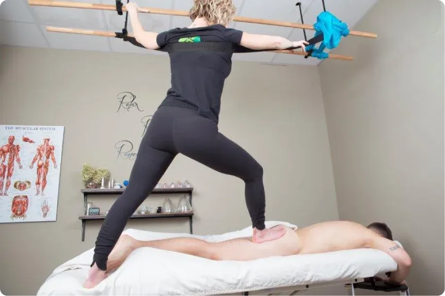 Person receiving a Ashiatsu Massage